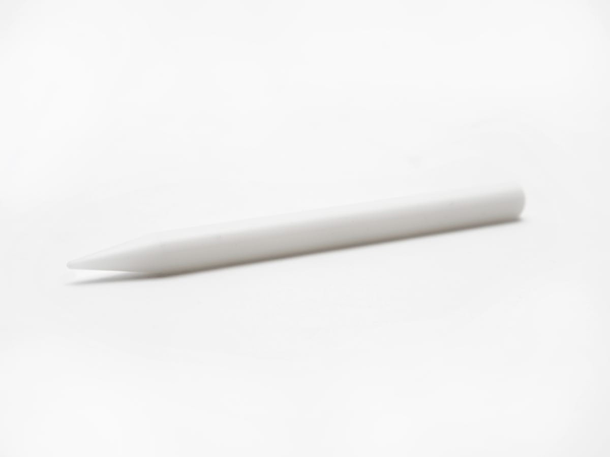 Braille-Eraser-Plastic White plastic pencil shaped braille eraser with a narrowed end and a flat end.