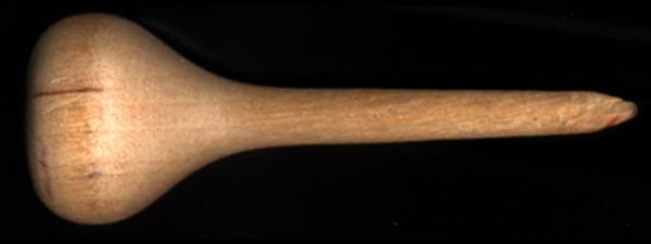 1-00270-00_Braille_eraser Wooden eraser with one flat side on handle and narrow wooden tip on a black background.