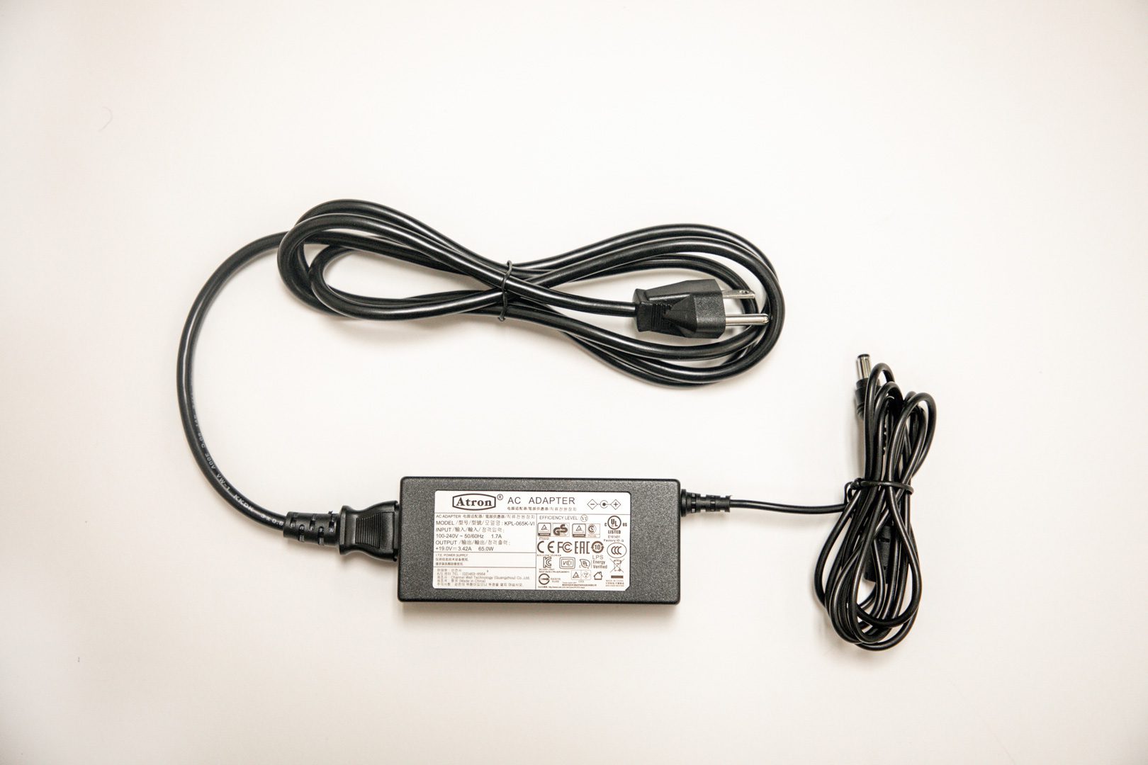 Jupiter-Power-Supply_1-00372-00_web Jupiter power supply consisting of a black power cord plugged into a black AC Adapter